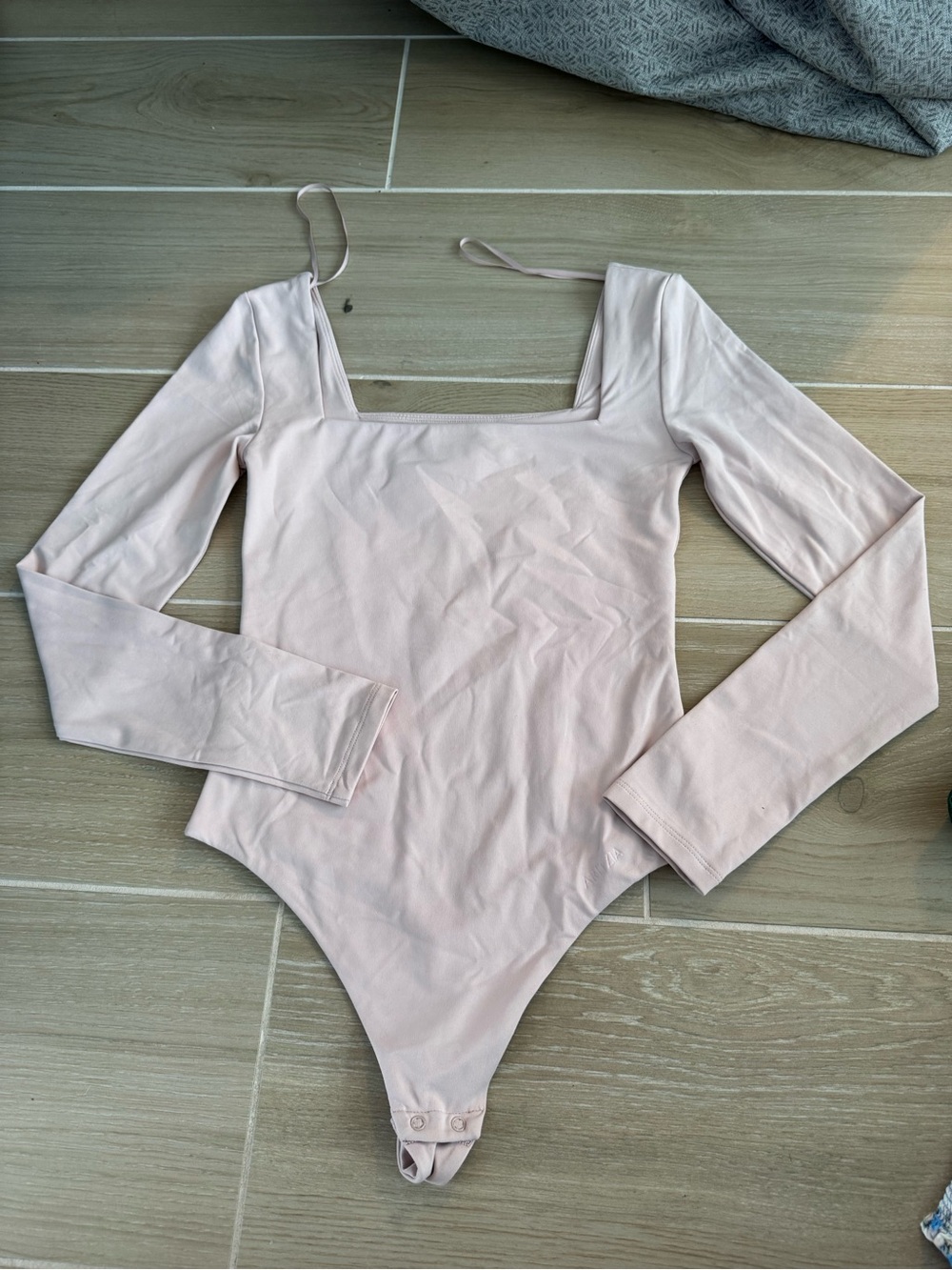 Long Sleeve One-Piece Bodysuit in Light Pink